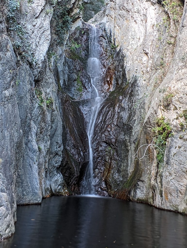 This is a waterfall in Ceret, France. it is about 20 feet tall.